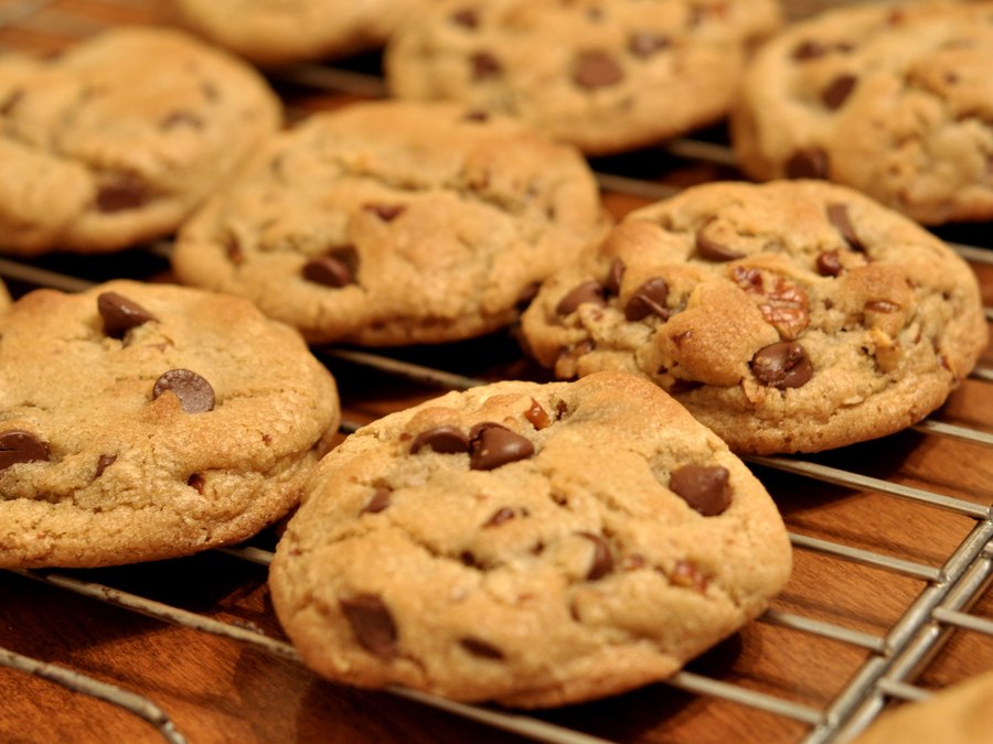 Finished eggless chocolate chip cookies cooling on a rack.